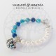 Pulsera Piedras Naturales Azules y perlas de agua imitación con dije llamador de Ángel.